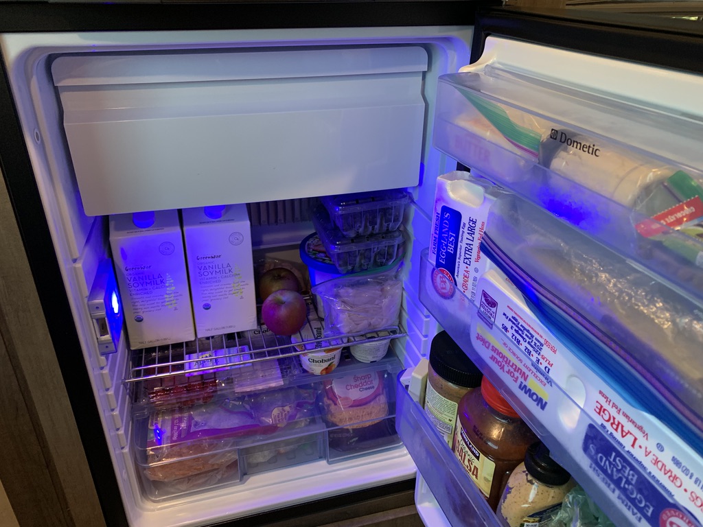 A picture containing indoor, refrigerator, open, food

Description automatically generated